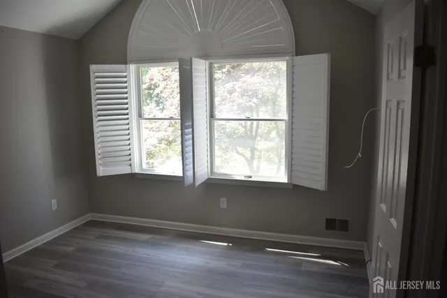 a bathroom with a sink and a window