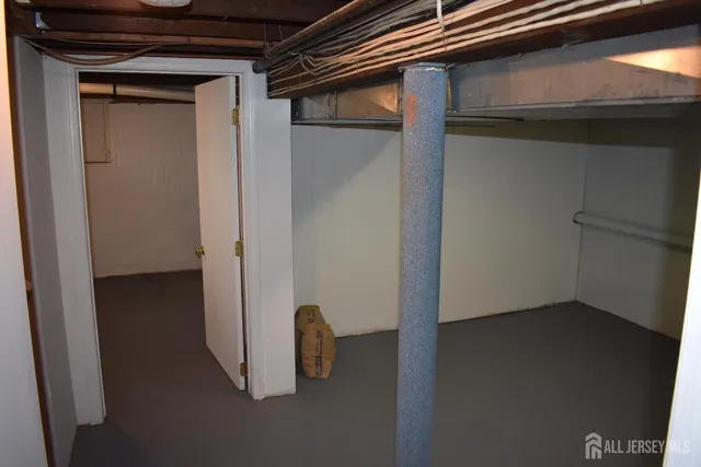 a view of a patio with a table and chair and potted plants