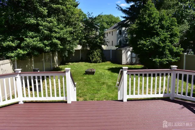 a view of a deck with a wooden fence