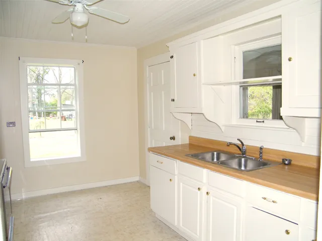 a kitchen with a sink and a window