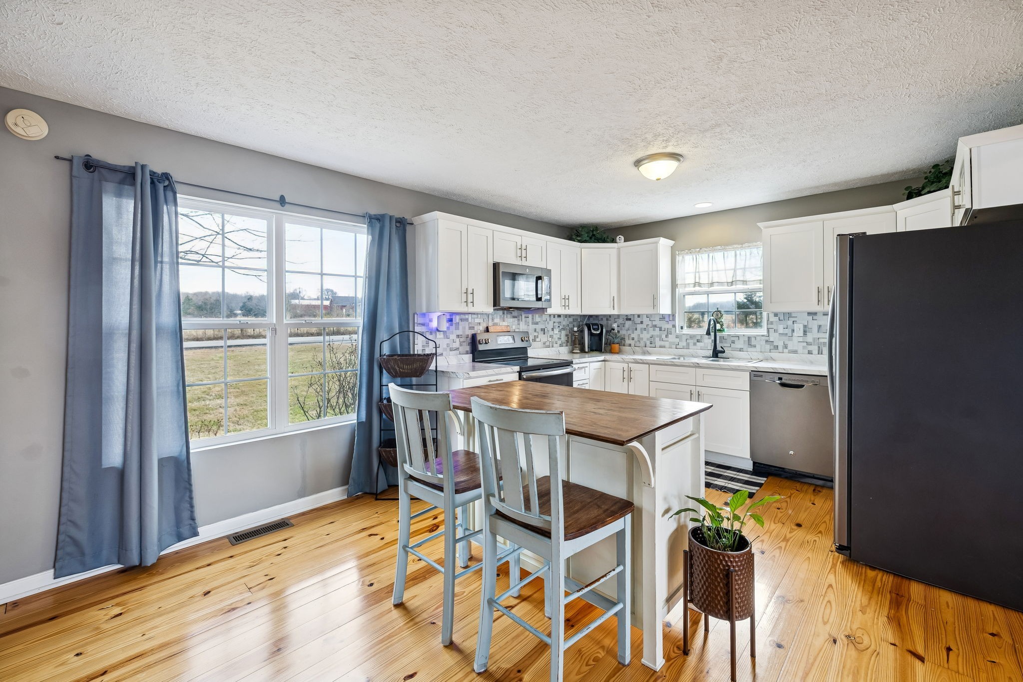 110 Ben Green Road Lebanon, TN 37090 - Photo 11 of 61 a kitchen with stainless steel appliances granite countertop a stove top oven a sink dishwasher and a refrigerator