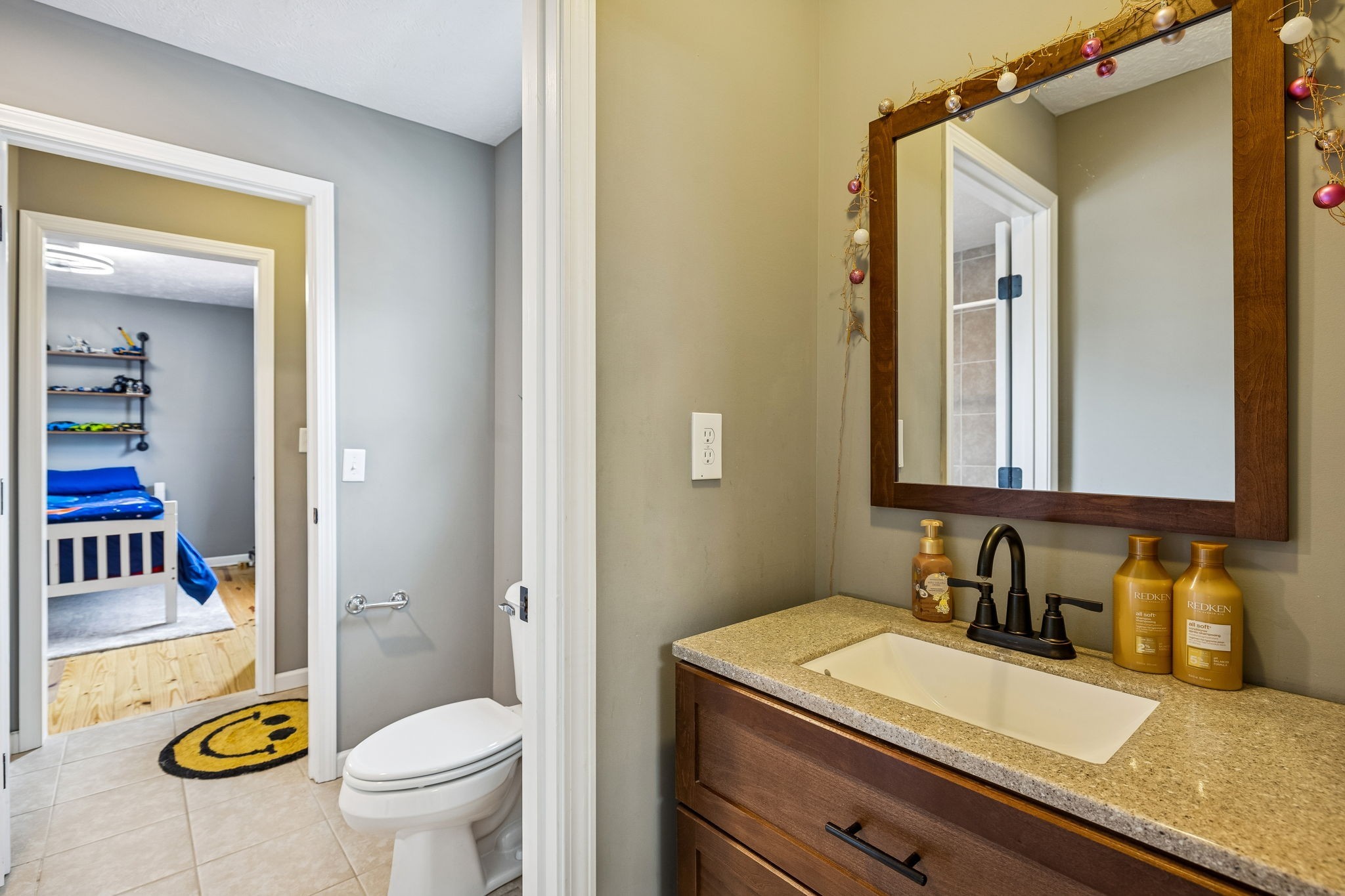 110 Ben Green Road Lebanon, TN 37090 - Photo 27 of 61 a bathroom with a granite countertop sink mirror vanity and toilet