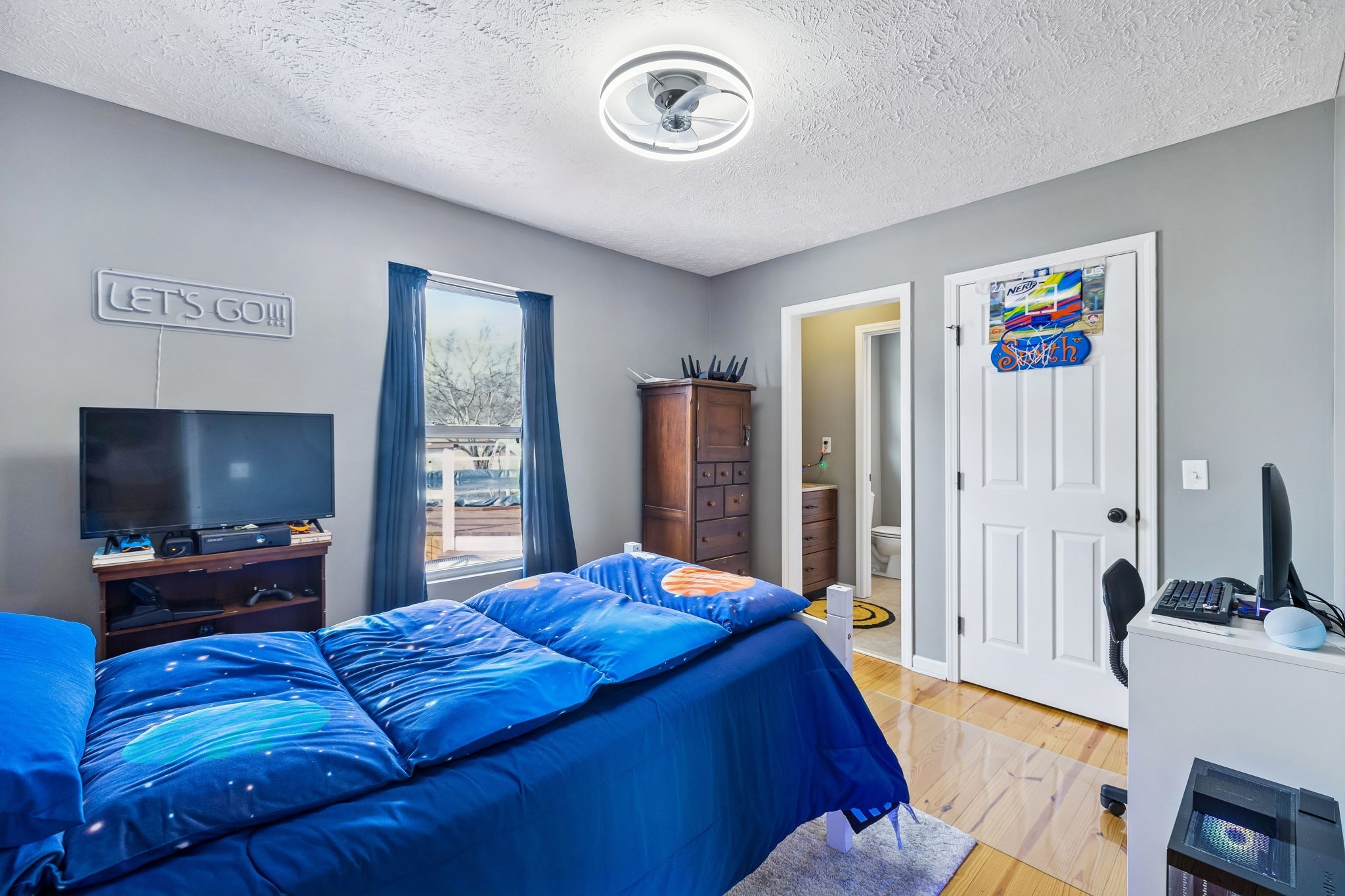 110 Ben Green Road Lebanon, TN 37090 - Photo 30 of 61 a bedroom with a bed and a flat screen tv