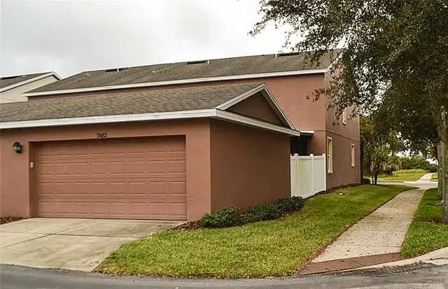 a small white house with a outdoor space