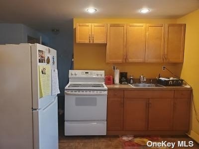 a kitchen with a stove top oven and cabinets