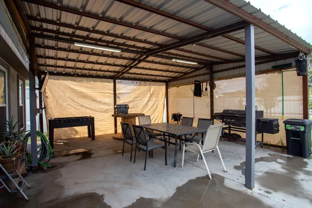 a view of a street with cars parked