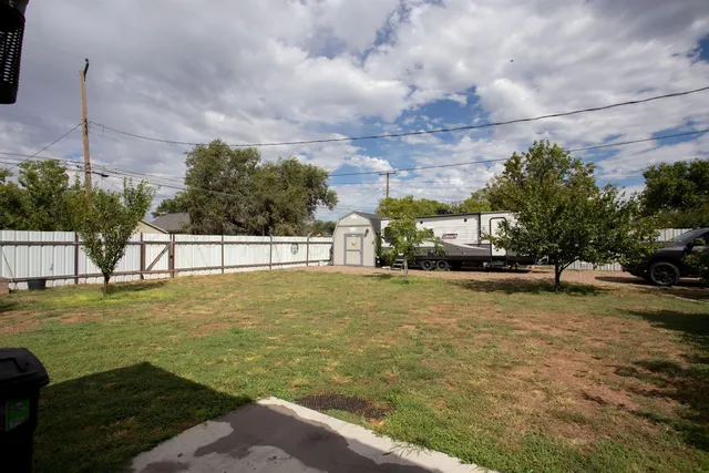 a view of a big yard with potted plants
