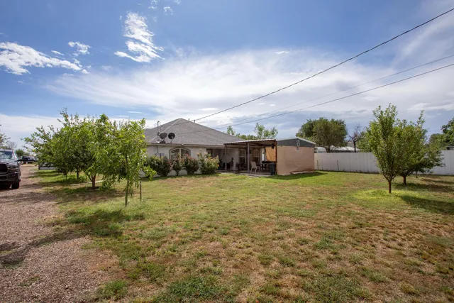 a backyard of a house with lots of green space