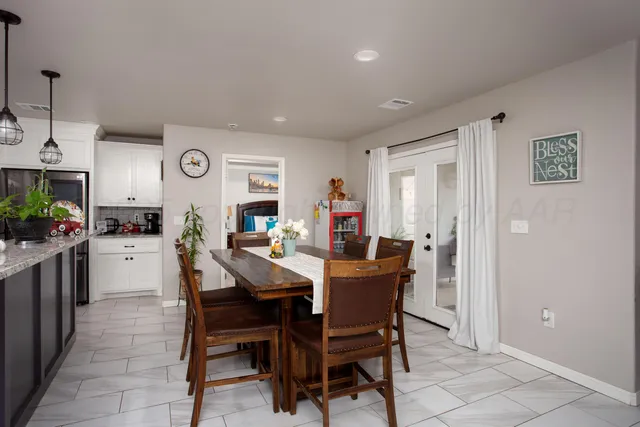 a view of a dining room and kitchen