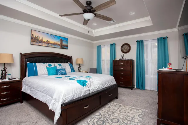 a bedroom with a bed and a dresser