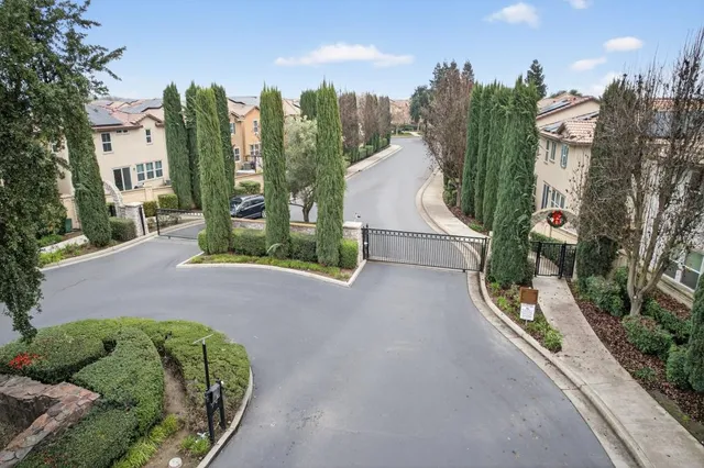 an aerial view of a house with swimming pool and outdoor space