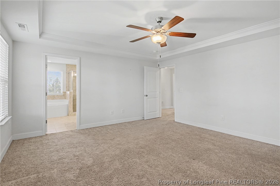 47 Pinnacle Drive Spring Lake, NC 28390 - Photo 22 of 50 an empty room with closet and a chandelier fan