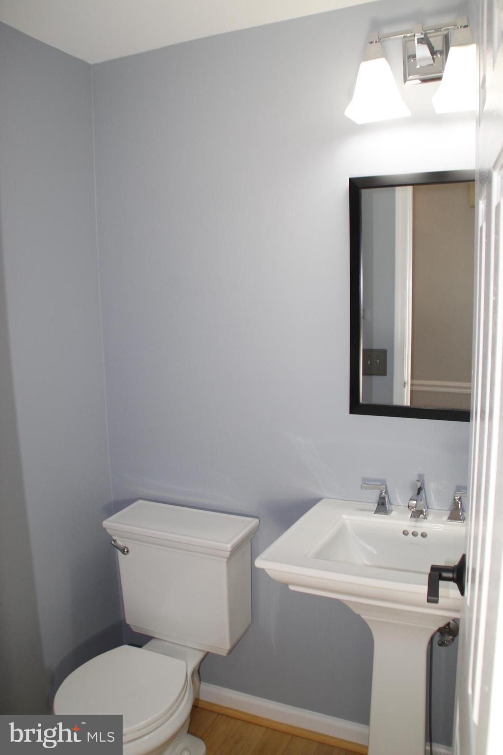 12507 Thunder Chase Drive Reston, VA 20191 - Photo 13 of 27 a bathroom with a sink toilet and mirror