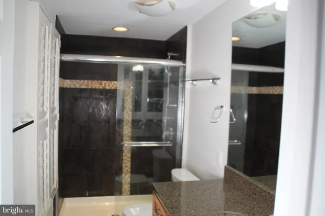 a bathroom with glass door