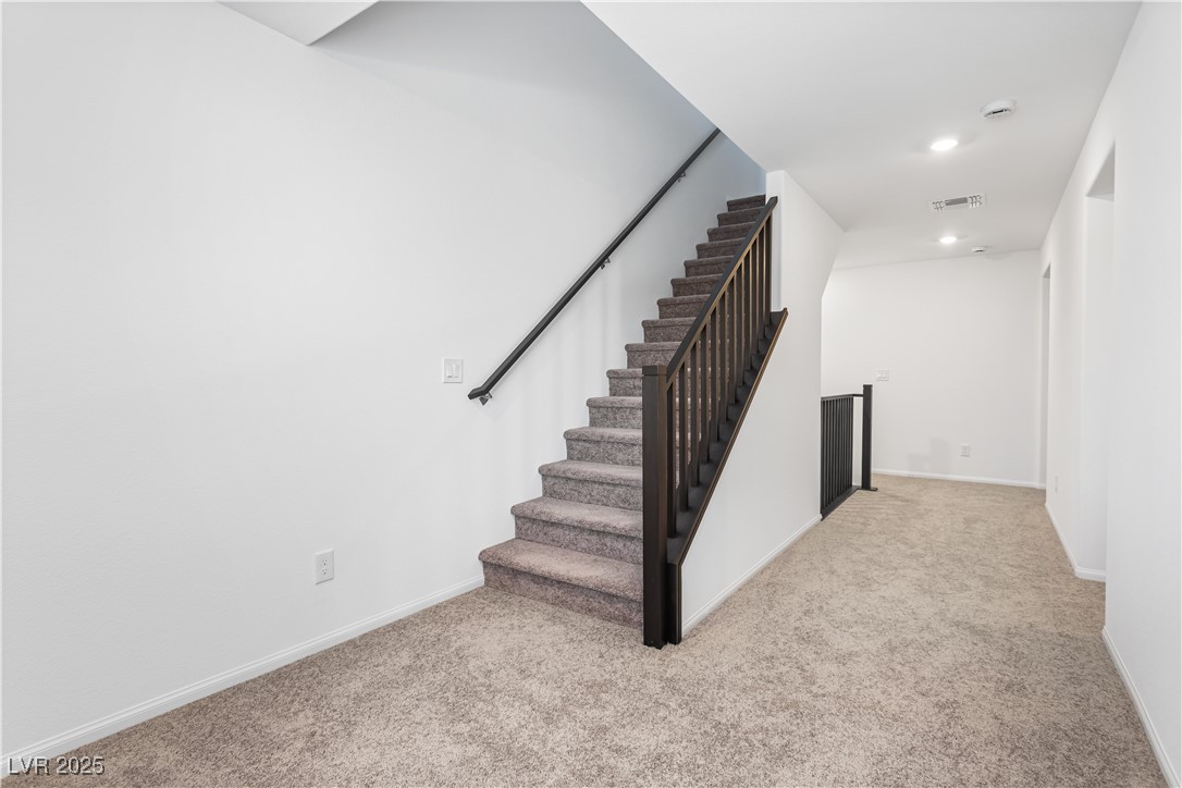 5646 Spring Trellis Street Las Vegas, NV 89113 - Photo 12 of 25 Staircase with carpet and recessed lighting