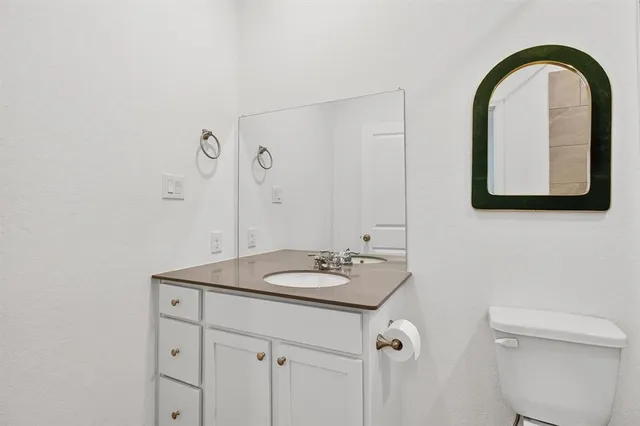 a bathroom with a toilet a sink and bathtub