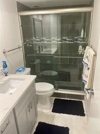 a bathroom with a sink and a shower