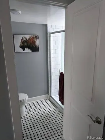 an aerial view of residential house with outdoor space and trees all around