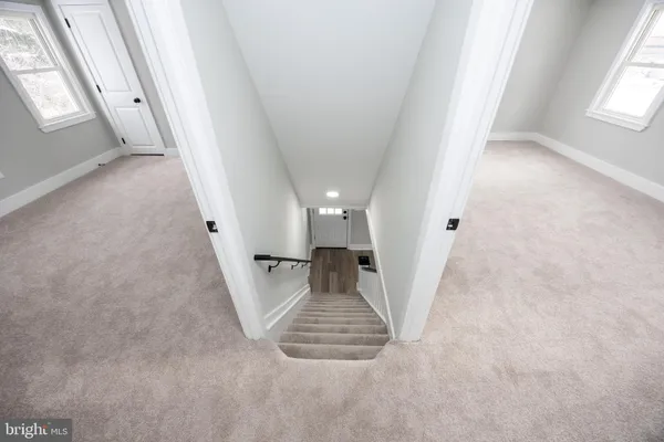an entryway in a house with wooden floor