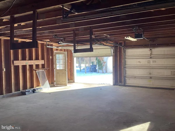 a view of a room with wooden walls