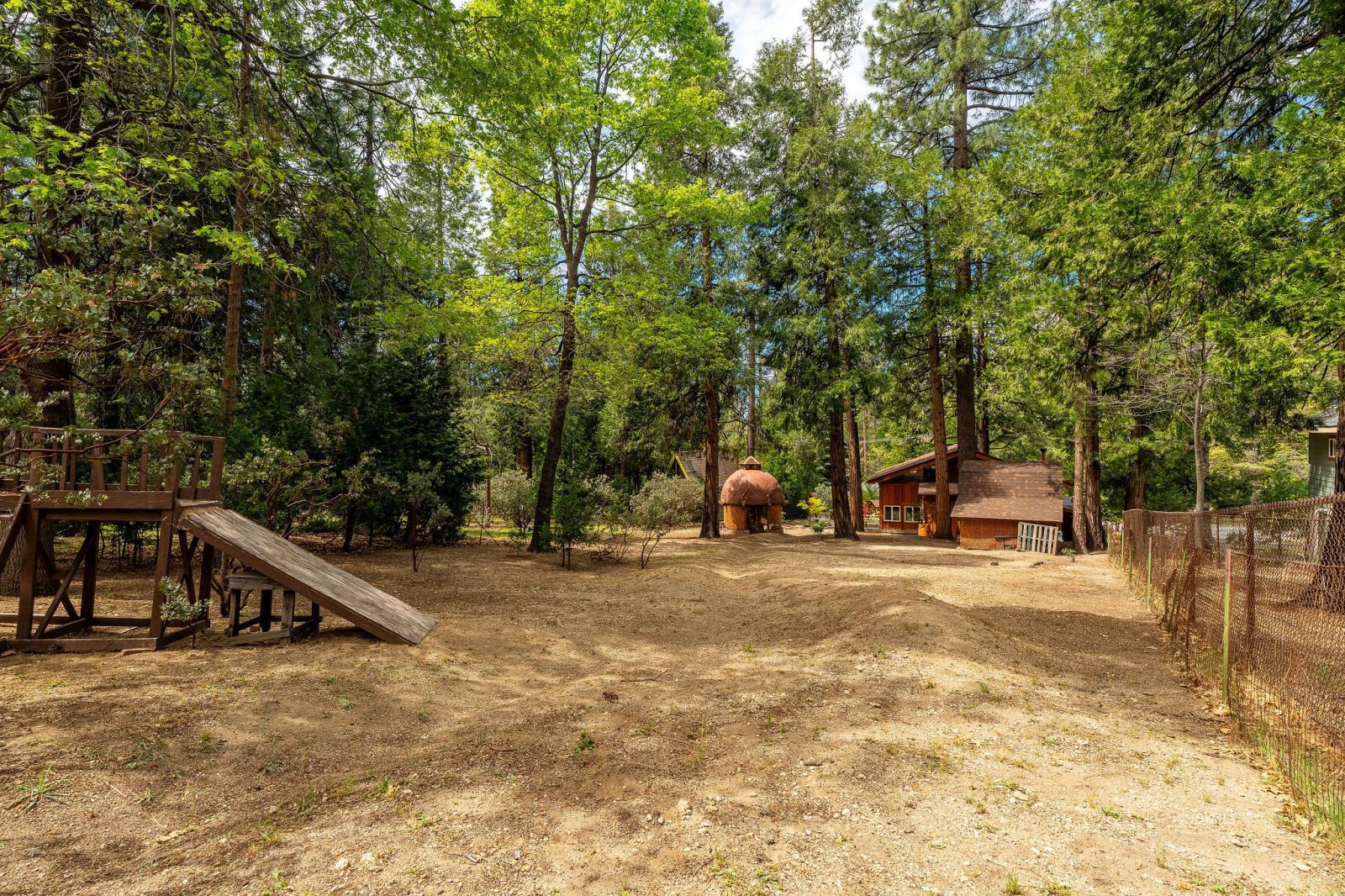 25106 Rim Rock Road Idyllwild, CA 92549 - Photo 64 of 71 a view of a house with a yard and large trees