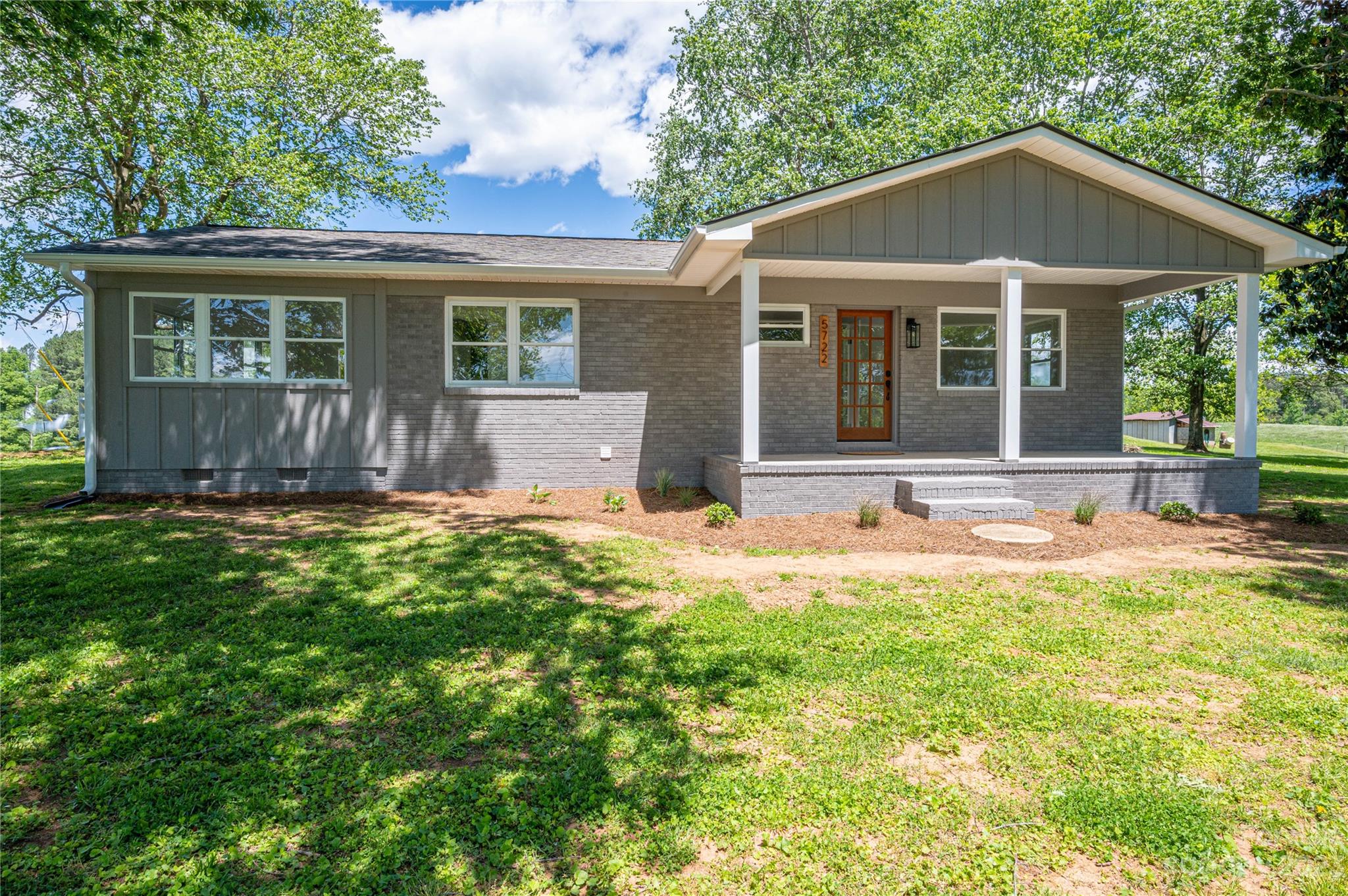 5722 Reepsville Road Vale, NC 28168 - Photo 1 of 30 a front view of a house with a yard and porch