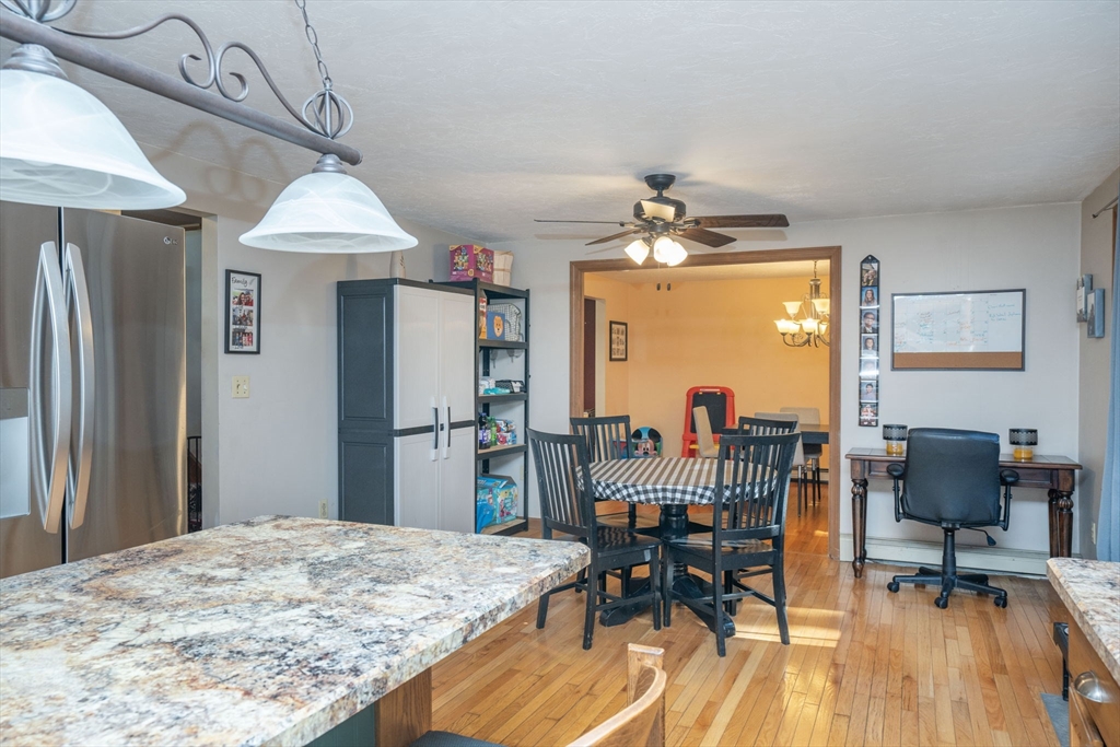 22 Dinahs Way Wareham, MA 02571 - Photo 14 of 42 a dining room with furniture a chandelier and wooden floor