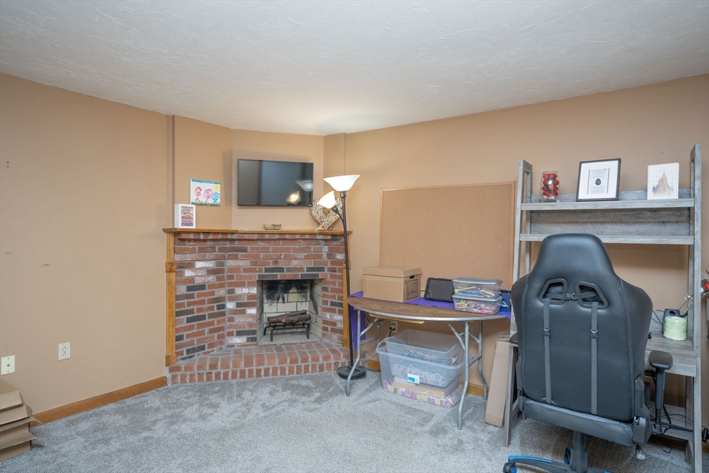 22 Dinahs Way Wareham, MA 02571 - Photo 18 of 42 a living room with furniture and a fireplace