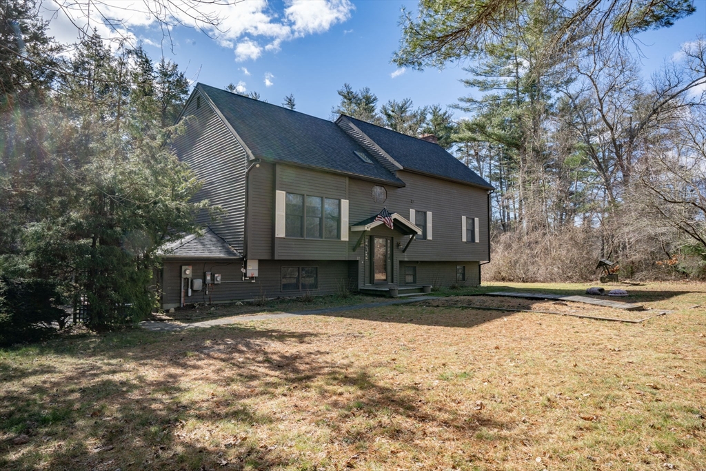 22 Dinahs Way Wareham, MA 02571 - Photo 2 of 42 a front view of a house with a yard and garage