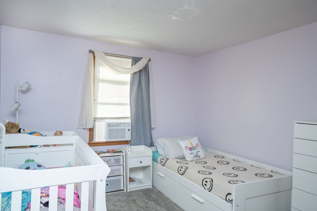 22 Dinahs Way Wareham, MA 02571 - Photo 26 of 42 a bedroom with a bed and a table in it