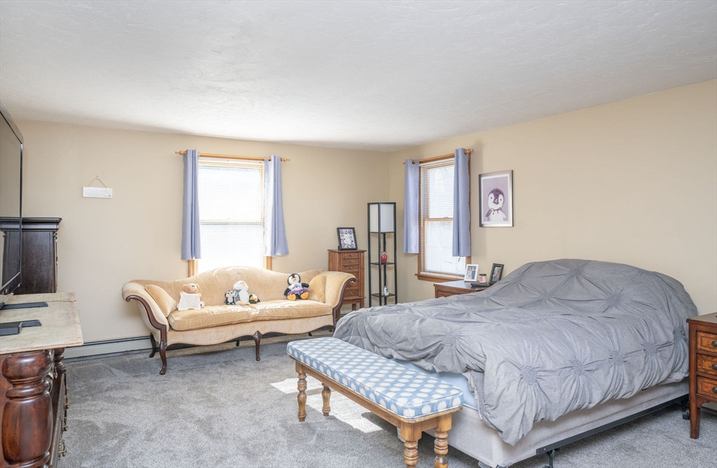 22 Dinahs Way Wareham, MA 02571 - Photo 29 of 42 a bedroom with a bed and a couch