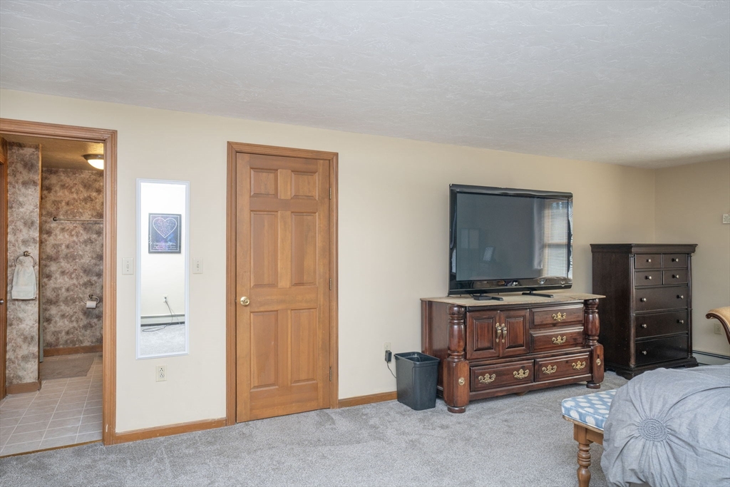 22 Dinahs Way Wareham, MA 02571 - Photo 31 of 42 a living room with furniture and flat screen tv