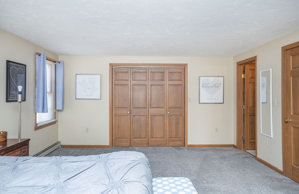 22 Dinahs Way Wareham, MA 02571 - Photo 32 of 42 a bedroom with a bed and a window