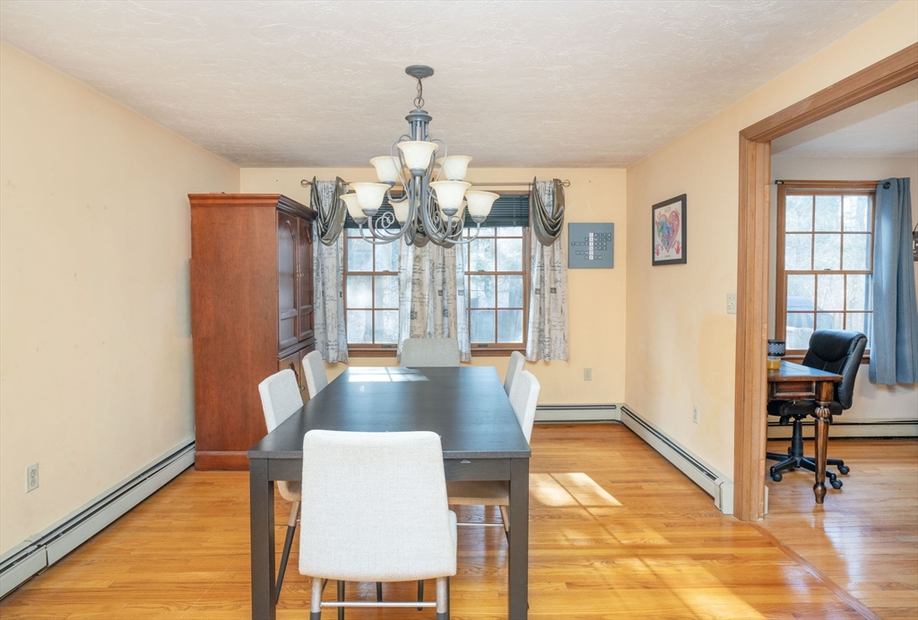 22 Dinahs Way Wareham, MA 02571 - Photo 7 of 42 a view of a dining room with furniture and wooden floor