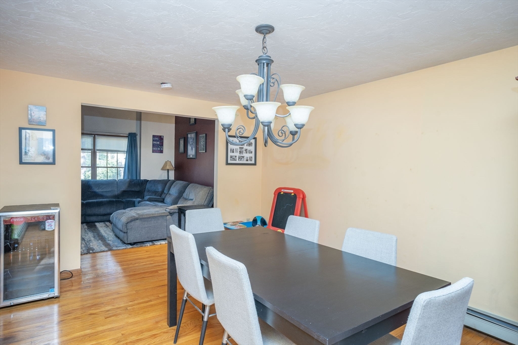 22 Dinahs Way Wareham, MA 02571 - Photo 8 of 42 a view of a dining room with furniture wooden floor and chandelier