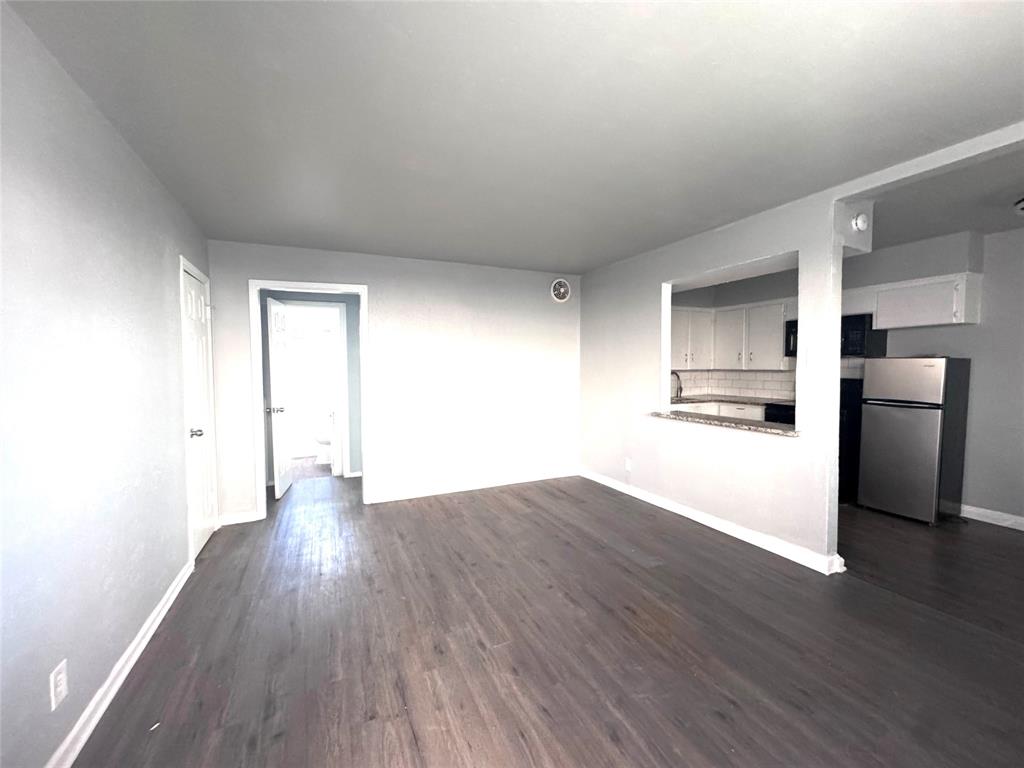 1417 Bennett Avenue Dallas, TX 75204 - Photo 4 of 14 a view of a kitchen with a sink and a refrigerator