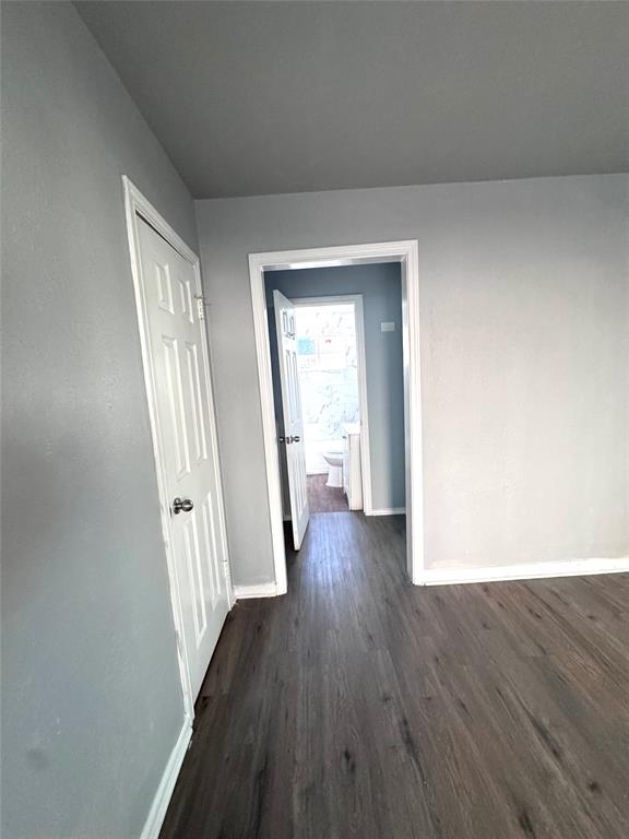 1417 Bennett Avenue Dallas, TX 75204 - Photo 7 of 14 a view of a hallway with wooden floor