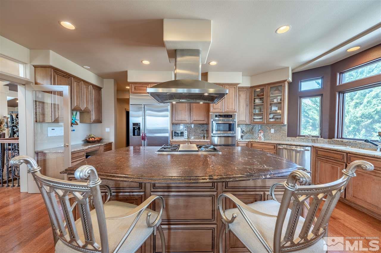 10055 Trailside Court Reno, NV 89511 - Photo 11 of 26 a view of a dining room with furniture window and outside view