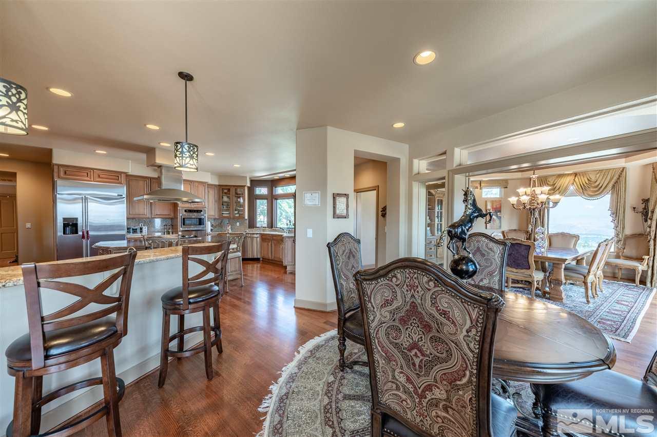 10055 Trailside Court Reno, NV 89511 - Photo 14 of 26 a view of a dining room and livingroom with furniture wooden floor a chandelier