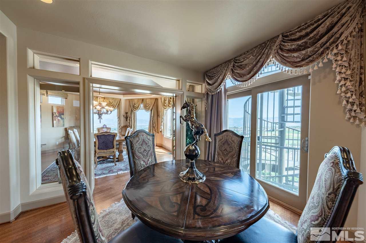 10055 Trailside Court Reno, NV 89511 - Photo 15 of 26 a dining room with furniture a chandelier and wooden floor