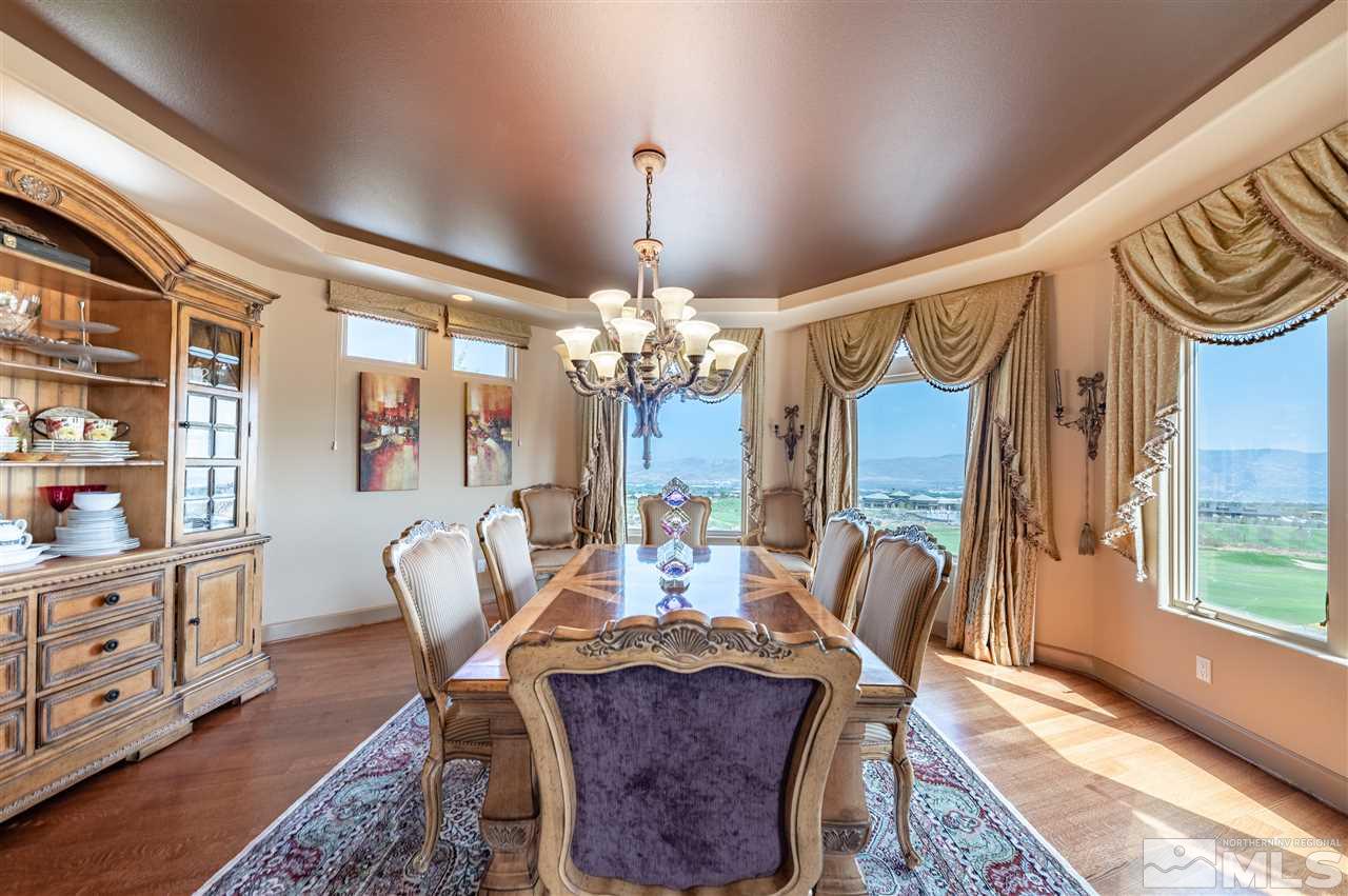 10055 Trailside Court Reno, NV 89511 - Photo 17 of 26 a view of a dining room with furniture a chandelier and wooden floor