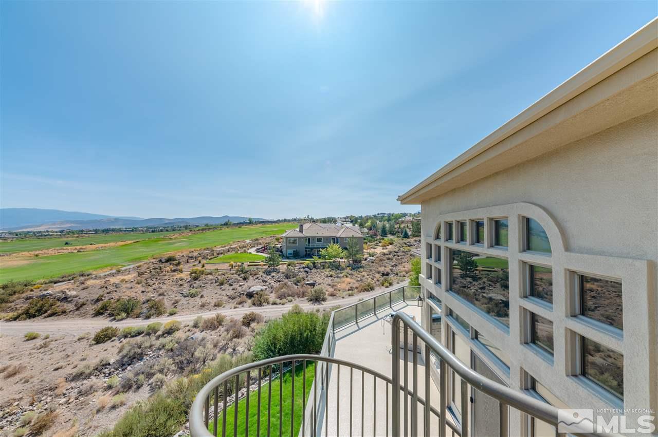 10055 Trailside Court Reno, NV 89511 - Photo 22 of 26 a view of a house with a yard