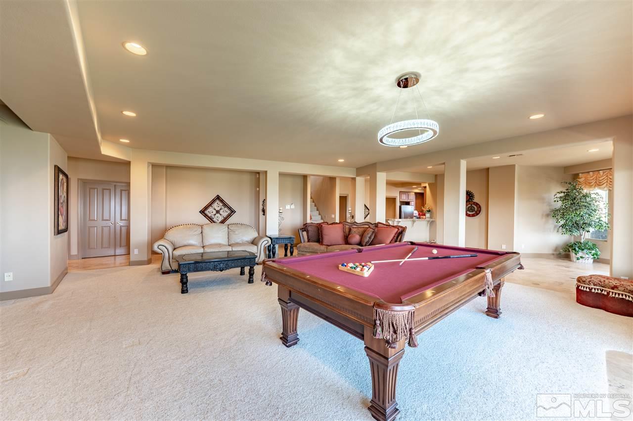 10055 Trailside Court Reno, NV 89511 - Photo 25 of 26 a living room with furniture pool table table and chairs