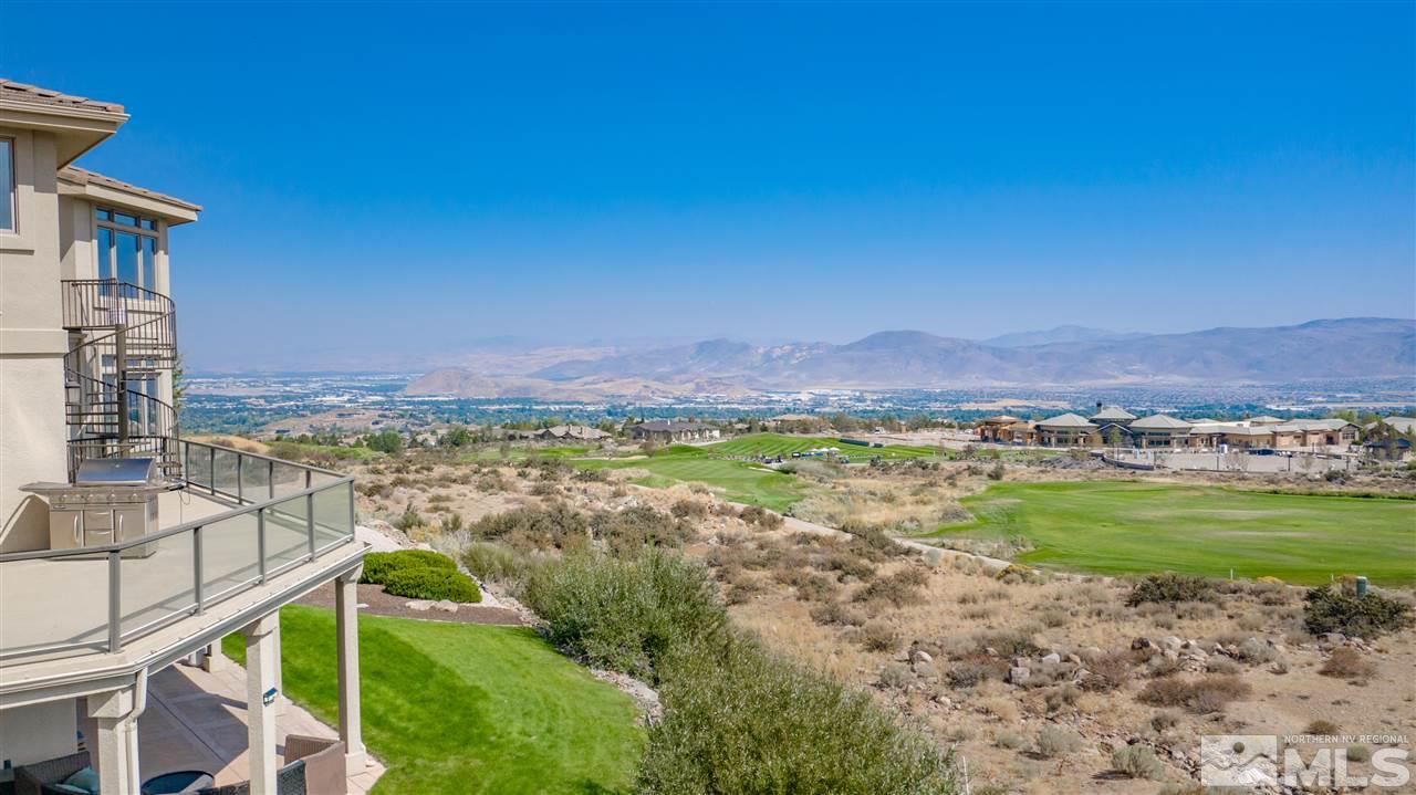 10055 Trailside Court Reno, NV 89511 - Photo 3 of 26 a view of a lush green field