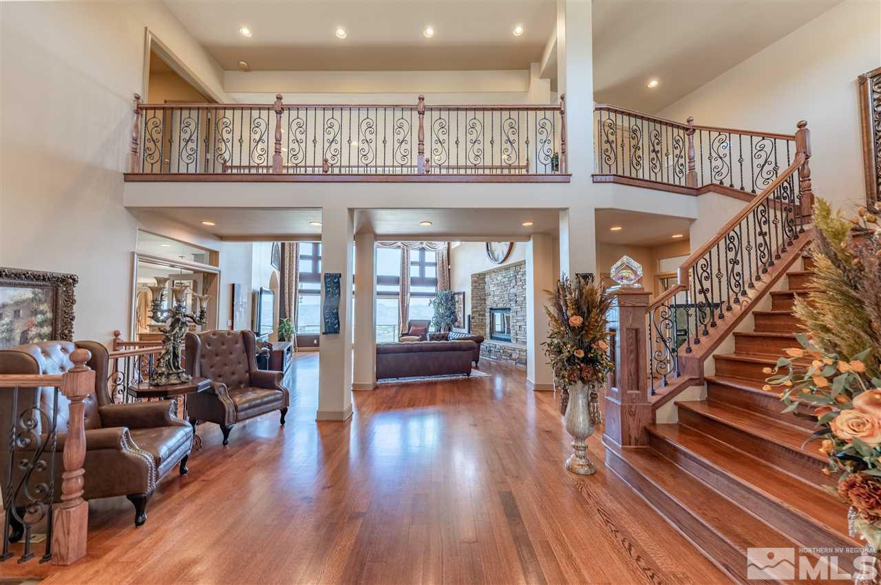 10055 Trailside Court Reno, NV 89511 - Photo 7 of 26 a view of entryway dining room and hall with wooden floor