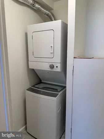 a bathroom with a sink mirror vanity and toilet