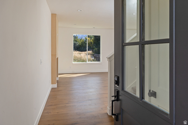612 North 400 West Logan, UT 84321 - Photo 12 of 27 Foyer with a dark gray paneled entry door, wood-finish flooring, recessed lighting, and a large picture window