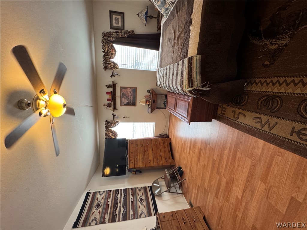 4222 Estrella Road Golden Valley, AZ 86413 - Photo 15 of 34 This room features light wood-look flooring and a ceiling fan with an integrated light fixture