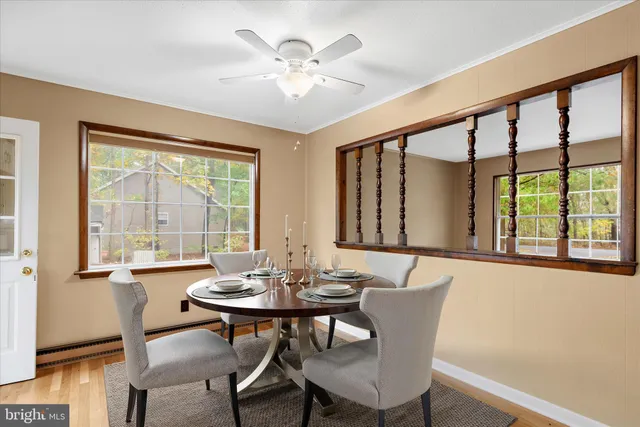 a view of a dining room with furniture window and wooden floor