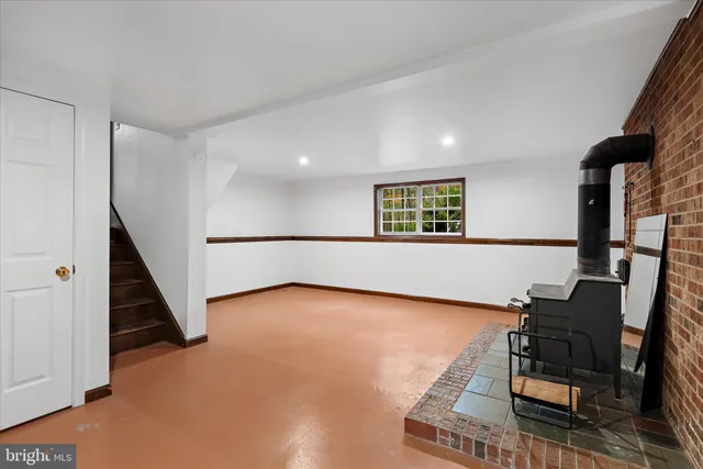 a view of a livingroom with furniture and stairs